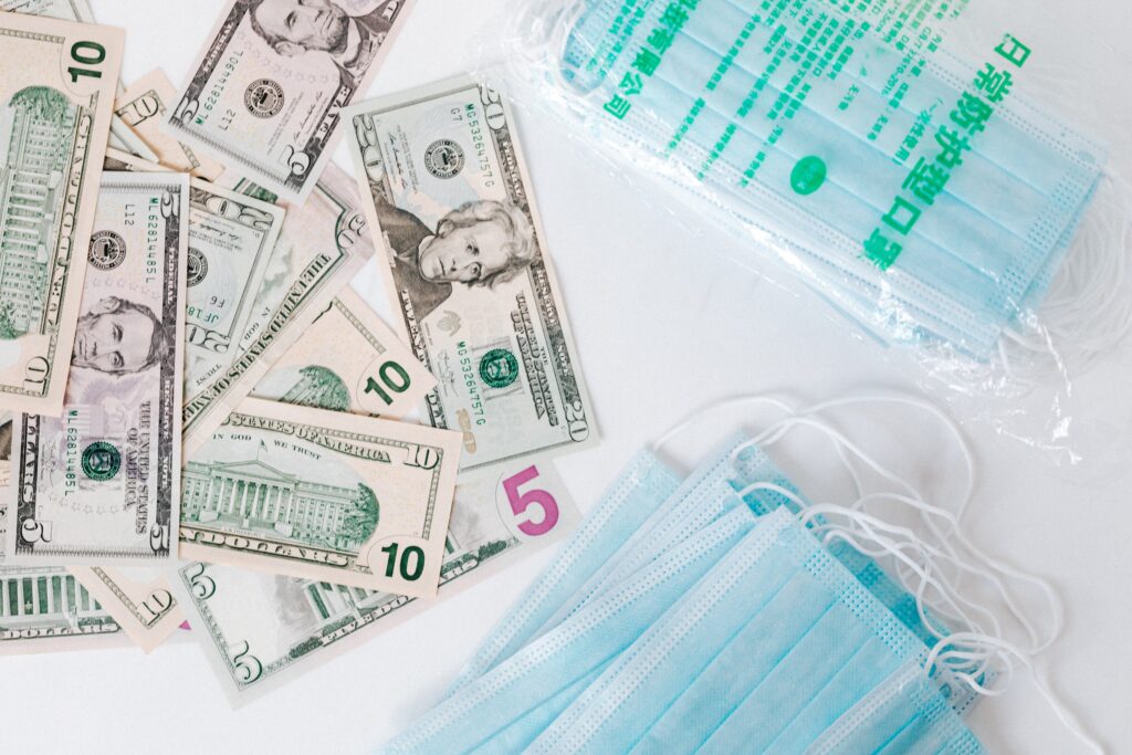 Medical equipment sits with ten dollar bills - an hsa can help you save on medical expenses